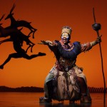 Brown Lindiwe Mkhize as Rafiki in Disney's The Lion King London Company. Photo by Catherine Ashmore  Disney