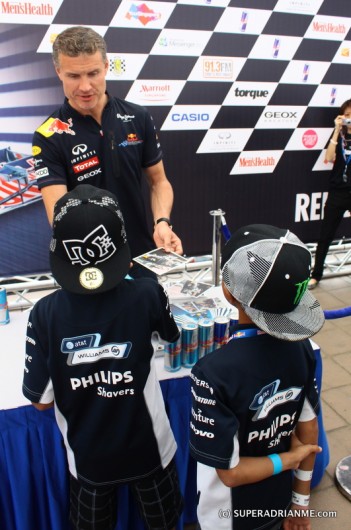 David Coulthard with the Kids during Autograph Session in Singapore