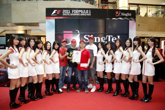 Top 12 SingTel Grid Girls and the winning team of the 24-Hour Simulator Challenge