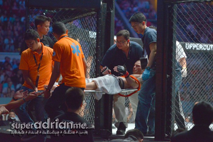 ONE FC - Jens Pulver beign sent out on a stretcher after being kicked in the groin by Ya Fei Zhao