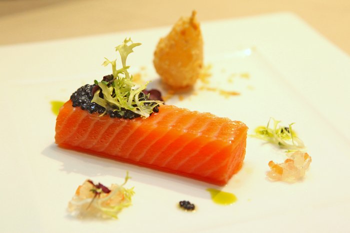 Sous Vide 48degree C King Salmon, sustainable Caviar and prosecco pear crushed almond, vine tomato jelly and Garden cress